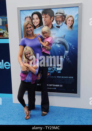 Volleyball star turned model Gabrielle Reece and her daughters Reece (L ...