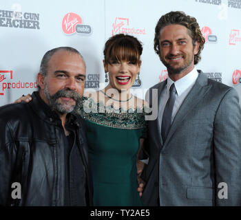 Sam Childers, Michelle Monaghan and Gerard Butler (L-R),  cast members in the motion picture 'Machine Gun Preacher, arrive for the premiere of the film at the Academy of Motion Picture Arts & Sciences in Beverly Hills, California on September 21, 2011.   UPI/Jim Ruymen Stock Photo