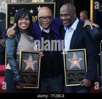 Gospel singers and musician CeCe Winans (L) and BeBe Winans (R) celebrate with producer Quincy Jones (C) during an unveiling ceremony honoring them with the 2,452nd star on the Hollywood Walk of Fame in Los Angeles on October 20, 2011. UPI/Jim Ruymen Stock Photo