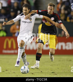 Los Angeles Galaxy defender Omar Gonzalez (4) and New York Red Bulls midfielder Jan Gunnar Solli battle for the ball in the second half in the MLS Western Conference Semifinals game at the Home Depot Center in Carson, California on Nov. 3, 2011. The Galaxy won 2-1. UPI/Lori Shepler. Stock Photo