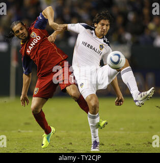 Real Salt Lake's Fabian Espindola and Los Angeles Galaxy defender Omar Gonzalez (4) battle for the ball in the second half in the MLS Western Conference Final game at the Home Depot Center in Carson, California on Nov. 6, 2011.  The Galaxy won 3-1.  UPI/Lori Shepler. Stock Photo