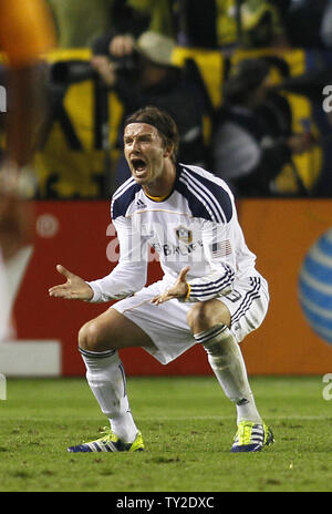 Los Angeles Galaxy midfielder David Beckham (23) celebrates a goal by Landon Donovan (10) against the Houston Dynamo in the second half of the MLS Cup at the Home Depot Center in Carson, California on Nov. 20, 2011. The Galaxy won 1-0.    UPI/Lori Shepler. Stock Photo
