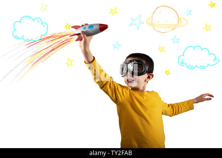 Child plays with a rocket. Concept of imagination. Isolated on white background Stock Photo