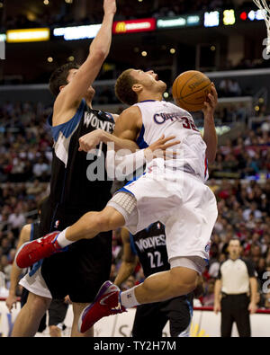 Los Angeles Clippers Blake Griffin is fouled by Minnesota Timberwolves Darko Milicic during fourth quarter action at Staples Center January 20, 2012. The Timberwolves defeated the Clippers 101-98.  UPI/Jon SooHoo Stock Photo