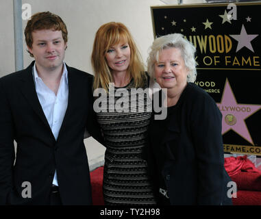 Actress Marg Helgenberger poses with her son Hugh Howard Rosenberg and mother Kay Snyder during an unveiling ceremony honoring her with the 2,458th star on the Hollywood Walk of Fame in Los Angeles on January 23, 2012. UPI/Jim Ruymen Stock Photo