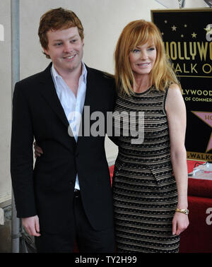 Actress Marg Helgenberger poses with her son Hugh Howard Rosenberg during an unveiling ceremony honoring her with the 2,458th star on the Hollywood Walk of Fame in Los Angeles on January 23, 2012. UPI/Jim Ruymen Stock Photo
