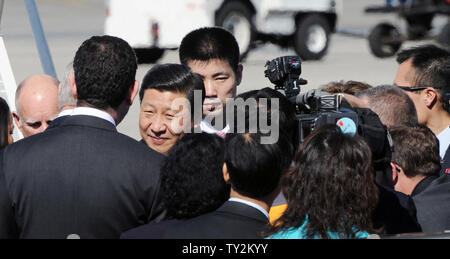 Visiting Chinese Vice President Xi Jinping (C) is greeted by dignitaries upon arrival at Los Angeles International Airport (LAX) in Los Angeles on February 16, 2012.  Xi Jinping will tour the China shipping terminal at the Port of Los Angeles with California governor Jerry Brown and Los Angeles mayor Antonio Villaraigosa today and members of his delegation will attend a seminar on U.S.-China trade relations and shared economic interests.  UPI/Jim Ruymen Stock Photo