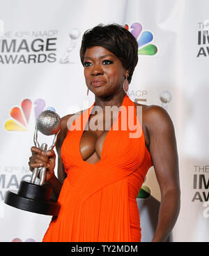 Actress Viola Davis holds the award for Outstanding Actress in a Motion Picture for 'The Help' in the press room at the 43rd NAACP Image Awards at the Shrine Auditorium in Los Angeles on February 17, 2012.  UPI/Danny Moloshok Stock Photo