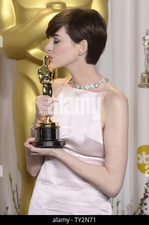 Anne Hathaway becomes emotional as she poses with her Oscar for Performance by an Actress in a Supporting Role for 'Les Miserables' backstage at the 85th Academy Awards at the Hollywood and Highlands Center in the Hollywood section of Los Angeles on February 24, 2013. UPI/Phil McCarten