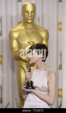 Anne Hathaway becomes emotional as she poses with her Oscar for Performance by an Actress in a Supporting Role for 'Les Miserables' backstage at the 85th Academy Awards at the Hollywood and Highlands Center in the Hollywood section of Los Angeles on February 24, 2013. UPI/Phil McCarten