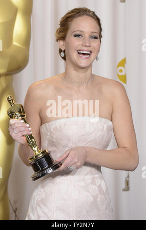 Jennifer Lawrence poses with her Oscar for Performance by an Actress in a Leading Role for 'Silver Linings Playbook' backstage at the 85th Academy Awards at the Hollywood and Highlands Center in the Hollywood section of Los Angeles on February 24, 2013. UPI/Phil McCarten Stock Photo