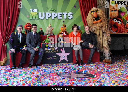 Hollywood Chamber of Commerce CEO Leron Gubler, Walt Disney Studios President Rich Ross, Lisa Henson and Sean Henson (L-R) attend the Inimitable Muppets unveiling ceremony honoring The Muppets  with the 2,466th star on the Hollywood Walk of Fame in Los Angeles on March 20, 2012. UPI/Jim Ruymen Stock Photo