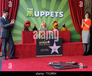 Walt Disney Studios President Rich Ross (L) and Lisa Henson attend the Inimitable Muppets unveiling ceremony honoring The Muppets  with the 2,466th star on the Hollywood Walk of Fame in Los Angeles on March 20, 2012. UPI/Jim Ruymen Stock Photo