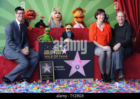 Walt Disney Studios President Rich Ross, Lisa Henson and Sean Henson (L-R) attend the Inimitable Muppets unveiling ceremony honoring The Muppets  with the 2,466th star on the Hollywood Walk of Fame in Los Angeles on March 20, 2012. UPI/Jim Ruymen Stock Photo