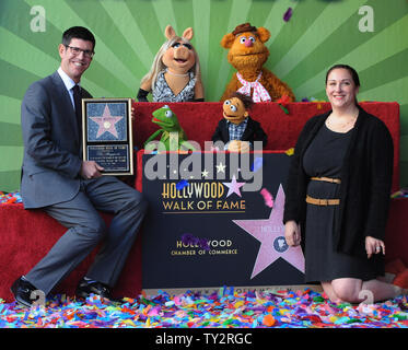 The Walt Disney Studios Chairman Rich Ross (L) and Lori MacPherson, EVP, Global Product Management - TWDS attend the Inimitable Muppets unveiling ceremony honoring The Muppets  with the 2,466th star on the Hollywood Walk of Fame in Los Angeles on March 20, 2012. UPI/Jim Ruymen Stock Photo