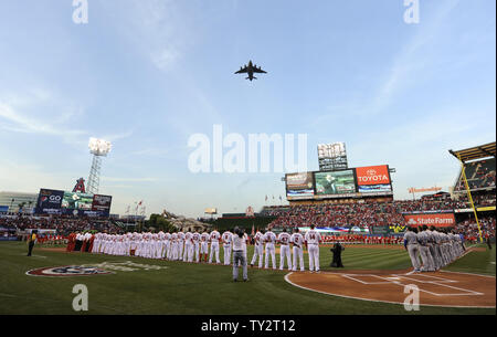 The Los Angeles Angels and Kansas City Royals line up for the National Anthem at Angel Stadium in Anaheim, California on April 6, 2012.  UPI/Lori Shepler. Stock Photo