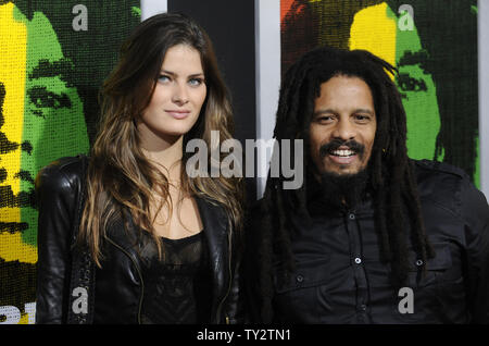 Rohan Marley (R) and Isabella Fontana attend the premiere of the film 'Marley' at the Arclight Theatre in the Hollywood section of Los Angeles on April 17, 2012.      UPI/Phil McCarten Stock Photo