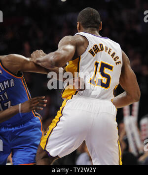 Los Angeles Lakers small forward Metta World Peace (15) throws his elbow into Oklahoma City Thunder guard James Harden (13) in the first half of an NBA basketball game in Los Angeles on April 22, 2012.    UPI/Lori Shepler Stock Photo