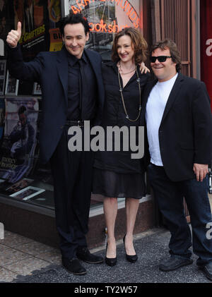 Actor John Cusack (L) poses with his sister, actress Joan Cusack (C) and actor Jack Black during an unveiling ceremony honoring him with the 2,469th star on the Hollywood Walk of Fame in Los Angeles on April 24, 2012.   UPI/Jim Ruymen Stock Photo