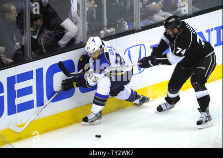 Los Angeles Kings left wing Dwight King (74) and St. Louis Blues defenseman Ian Cole (23) battle for the puck in the first period of Game 4 of the NHL Western Conference Semifinals at Staples Center in Los Angeles, California on May 6, 2012.    UPI/Lori Shepler. Stock Photo