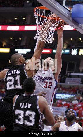 San Antonio Spurs center Tim Duncan (21) blocks a shot by Los Angeles Clippers forward Blake Griffin (32) with Spurs forward Boris Diaw (33), of France and Clippers forward Reggie Evans, right, looking on during the second half of Game 3 of the Western Conference semifinals at Staples Center in Los Angeles on May 19, 2012. The Spurs won the game 96-86.   UPI/Alex Gallardo Stock Photo