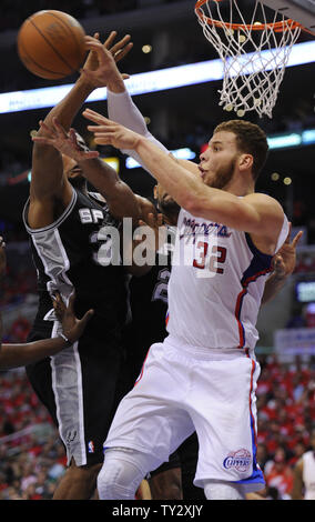 Los Angeles Clippers power forward Blake Griffin (32) passes over San Antonio Spurs power forward Boris Diaw (33) during the second half of game 4 of the Western Conference Semifinals at Staples Center in Los Angeles on May 20, 2012. The Spurs won 102-99. UPI /Lori Shepler Stock Photo