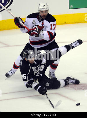 New Jersey Devils left wing Ilya Kovalchuk (17) and Los Angeles Kings defenseman Slava Voynov (26) battle for the puck in the first period in game 3 of the NHL Stanley Cup Finals at the Staples Center in Los Angeles, California on June 4, 2012.  UPI/Lori Shepler. Stock Photo