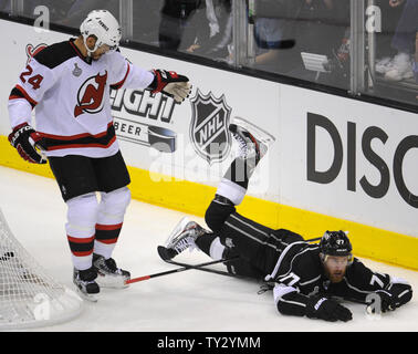 New Jersey Devils defenseman Bryce Salvador 24 trips up Los Angeles Kings center Jeff Carter 77 in the second period of Game 4 of the NHL Stanley Cup Finals at the Staples