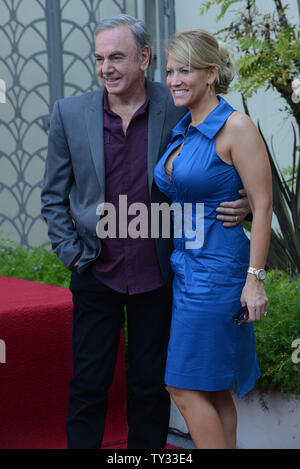 Singer and songwriter Neil Diamond poses with his wife Katie McNeil during the unveiling ceremony honoring him with the 2,475th on the Hollywood Walk of Fame, outside the Capitol Records Building in Los Angeles on August 10, 2012. Diamond, whose career has spanned five decades from the 1960's to the present, is considered one of the most successful adult contemporary artists ever according to the Billboard chart.  UPI/Jim Ruymen Stock Photo