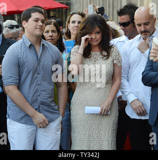 Television personality Valerie Bertinelli (C) shares a moment with her son, musician Wolfgang Van Halen (L) and husband Tom Vitale (R), during an unveiling ceremony honoring her with the 2,476th star on the Hollywood Walk of Fame in Los Angeles on August 22, 2012.   UPI/Jim Ruymen Stock Photo