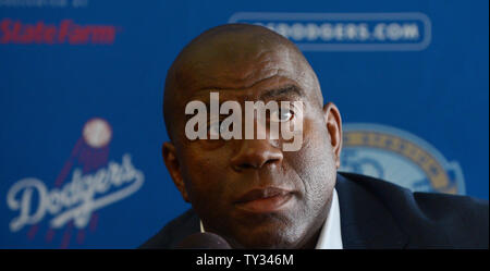 Dodgers' co-owner Earvin 'Magic' Johnson participates in a news conference announcing the Los Angeles Dodgers acquisition of All-.Stars Adrian Gonzalez and Carl Crawford, World Series MVP pitcher Josh Beckett and.infielder Nick Punto and cash from the Red Sox, during a news conference at Dodgers Stadium in Los Angeles on August 25, 2012. The Dodgers will pick up more than $260 million in payroll costs from the Sox, according to various published reports. UPI/Jim Ruymen Stock Photo