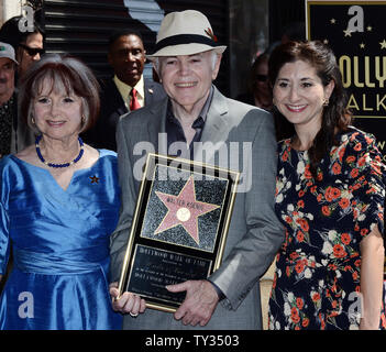 Actor Walter Koenig holds a replica plaque as he poses with his wife Judy Levitt (L) and daughter Danielle Koenig, during an unveiling ceremony honoring him with the 2,479th star on the Hollywood Walk of Fame in Los Angeles on September 10, 2012.  Koenig is the final member of the 'Star Trek' television show to receive a star.   UPI/Jim Ruymen Stock Photo