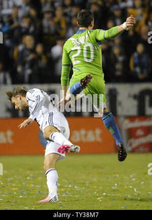 Seattle Sounders FC defender Zach Scott (20) collides with Los Angeles Galaxy midfielder David Beckham (23) in the first half of an MLS Western Conference Finals game at the Home Depot Center in Carson, California on Nov. 11, 2012.    UPI/Lori Shepler. Stock Photo