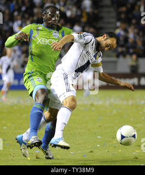 Seattle Sounders FC defender Jhon Kennedy Hurtado, left, and Los Angeles Galaxy midfielder Landon Donovan (10) battle for the ball in the first half of an MLS Western Conference Finals game at the Home Depot Center in Carson, California on Nov. 11, 2012.    UPI/Lori Shepler. Stock Photo