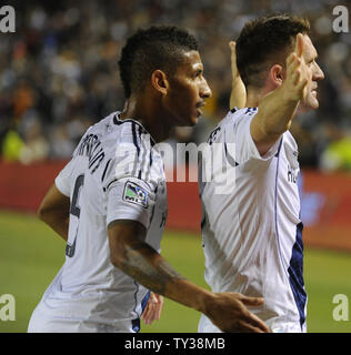 Los Angeles Galaxy defender Sean Franklin, left, congratulates Los Angeles Galaxy forward Robbie Keane, right, after he scored a goal against the Seattle Sounders in the first half of an MLS Western Conference Finals game at the Home Depot Center in Carson, California on Nov. 11, 2012.    UPI/Lori Shepler. Stock Photo