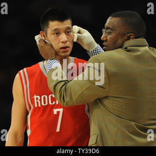 Houston Rockets point guard Jeremy Lin is treated for a cut on his face in the first half of an NBA basketball game against the Los Angeles Lakers in Los Angeles on November 18, 2012.    UPI/Lori Shepler Stock Photo