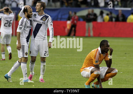 Landon Donovan and David Beckham react as the Los Angeles Galaxy defeated the Houston Dynamo 3-1in the MLS Cup at the Home Depot Center in Carson, California on December 1, 2012.  UPI/Jonathan Alcorn Stock Photo