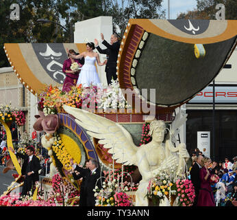 Gerald Sapienza and Nicole Angelillo of Chesapeake, Va., kiss after being declared man and wife in a special Rose Parade ceremony. The newlyweds beat out three other couples vying to get married aboard Farmers InsuranceÕs ÒThe Love FloatÓ, as they participate in the 124th Tournament of Roses Parade held in Pasadena, California on January 1, 2013.  UPI/Jim Ruymen Stock Photo