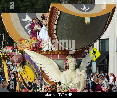 Gerald Sapienza and Nicole Angelillo of Chesapeake, Va., kiss after being declared man and wife in a special Rose Parade ceremony. The newlyweds beat out three other couples vying to get married aboard Farmers InsuranceÕs ÒThe Love FloatÓ, as they participate in the 124th Tournament of Roses Parade held in Pasadena, California on January 1, 2013.  UPI/Jim Ruymen Stock Photo