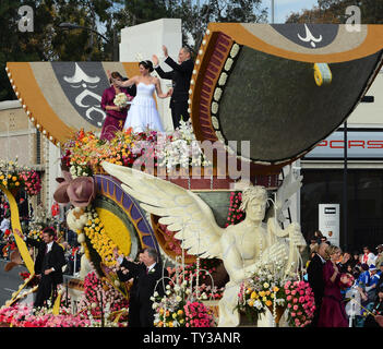 Gerald Sapienza and Nicole Angelillo of Chesapeake, Va., kiss after being declared man and wife in a special Rose Parade ceremony. The newlyweds beat out three other couples vying to get married aboard Farmers InsuranceÕs ÒThe Love FloatÓ, as they participate in the 124th Tournament of Roses Parade held in Pasadena, California on January 1, 2013.  UPI/Jim Ruymen Stock Photo