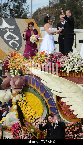 Gerald Sapienza and Nicole Angelillo of Chesapeake, Va., kiss after being declared man and wife in a special Rose Parade ceremony. The newlyweds beat out three other couples vying to get married aboard Farmers InsuranceÕs ÒThe Love FloatÓ, as they participate in the 124th Tournament of Roses Parade held in Pasadena, California on January 1, 2013.  UPI/Jim Ruymen Stock Photo