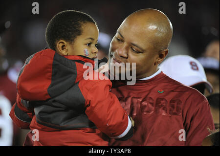 Stanford Cardinal head coach David Shaw holds his son Gavin after winning 2013 Vizio Rose Bowl game against the Wisconsin Badgers 20-14 in Pasadena, California on January 1, 2013.  UPI/Jon SooHoo Stock Photo