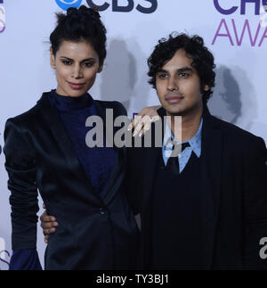 Kunal Nayyar (R) and Neha Kapur attend the People's Choice Awards 2013 at Nokia Theatre L.A. Live in Los Angeles on January 9, 2013.  UPI/Jim Ruymen Stock Photo