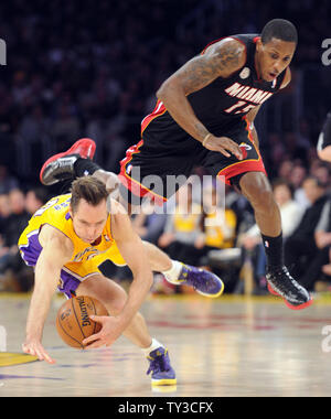 Los Angeles Lakers point guard Steve Nash (10) is tripped by Miami Heat point guard Mario Chalmers (15) in the first half at Staples Center in Los Angeles on January 17,  2013.    UPI/Lori Shepler Stock Photo
