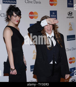 Singer Patti Smith and her daughter Jesse Smith arrive at the Clive Davis pre-Grammy party and salute to Antonio 'L.A.' Reid, at the Beverly Hilton Hotel in Beverly Hills, California on February 9, 2013.  UPI/Jim Ruymen Stock Photo