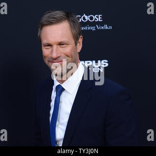 Actor Aaron Eckhart, a cast member in the motion picture thriller 'Olympus Has Fallen', attends the premiere of the film at the ArcLight Cinerama Dome in the Hollywood section of Los Angeles on March 18, 2013. In a national security thriller, Antoine Fuqua directs an all-star cast featuring Gerard Butler, Morgan Freeman, Angela Bassett, Melissa Leo, Ashley Judd and Rick Yune. UPI/Jim Ruymen Stock Photo