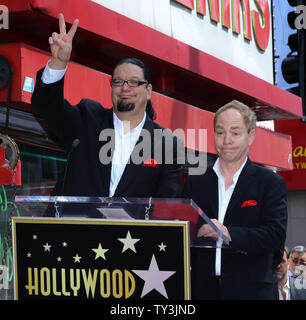 Penn Jillette (L) and Raymond Teller of the comedy magic duo Penn & Teller conclude their comments, during an unveiling ceremony, honoring the pair with the 2,494th star on the Hollywood Walk of Fame in Los Angeles on April 5, 2013.  UPI/Jim Ruymen Stock Photo