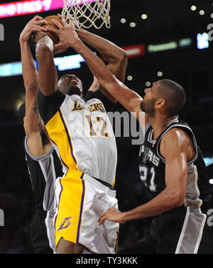Los Angeles Lakers center Dwight Howard (12) is fouled by San Antonio Spurs power forward Tim Duncan (21) in the second half at Staples Center in Los Angeles on April 14, 2013. Lakers won 91 to 86. UPI/Lori Shepler Stock Photo