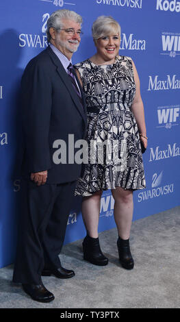 Director George Lucas and his daughter Katie Lucas arrive for the Women In Film Crystal + Lucy Awards at the the Beverly Hilton Hotel in Beverly Hills, California on June 12, 2013. UPI/Jim Ruymen Stock Photo