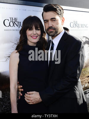 Ron Livingston attends with wife Rosemarie DeWitt the premiere of 'The Conjuring' at the Cinerama Dome in Los Angeles on July 15, 2013.  Based upon a true story, the movie tells of world renowned paranormal investigators Ed and Lorraine Warren and how they were called upon to help a terrorized family at a secluded farmhouse.     UPI/Jim Ruymen Stock Photo